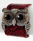 RED SNAKE PRINT LEATHERETTE/RH​INESTONE OWL BUCKLET BRACELET