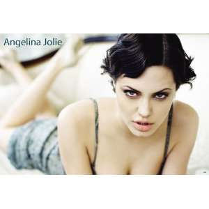 Angelina Jolie dark eyed sexy POSTER 34 x 23.5 lying on bed (poster 