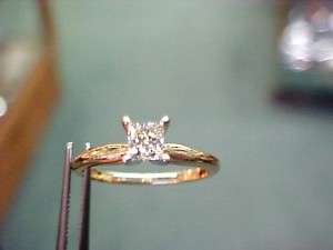 Ladies .50 princess cut diamond solitaire 14k yg ring  