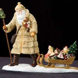    Limited Edition Santa Pulling Sled Figurine: Home & Kitchen