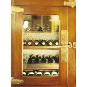 Several Wine Bottles in Wood Panelled Drinks Cabinet Photographic 